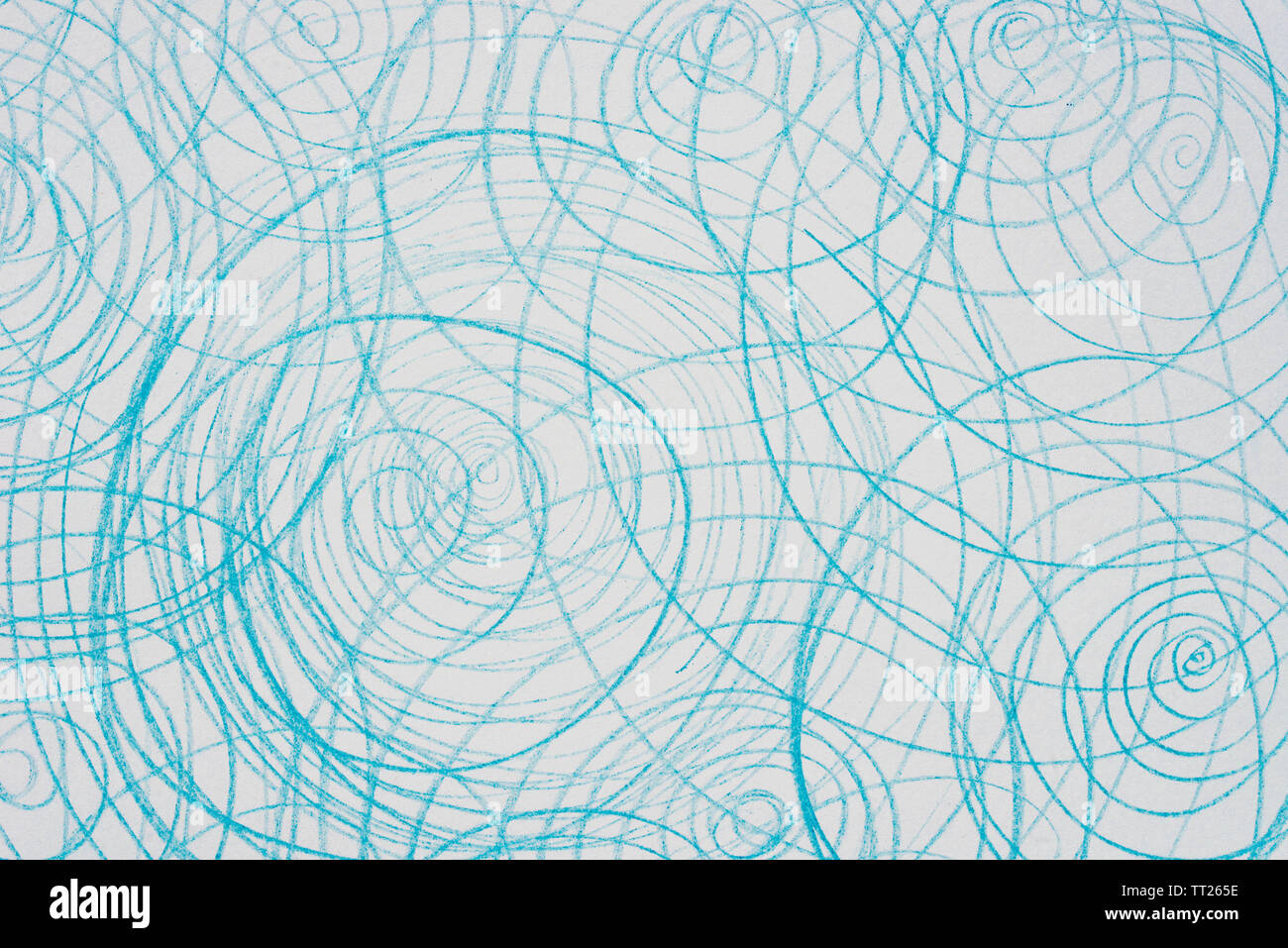 blue crayon doodles on white paper background Stock Photo