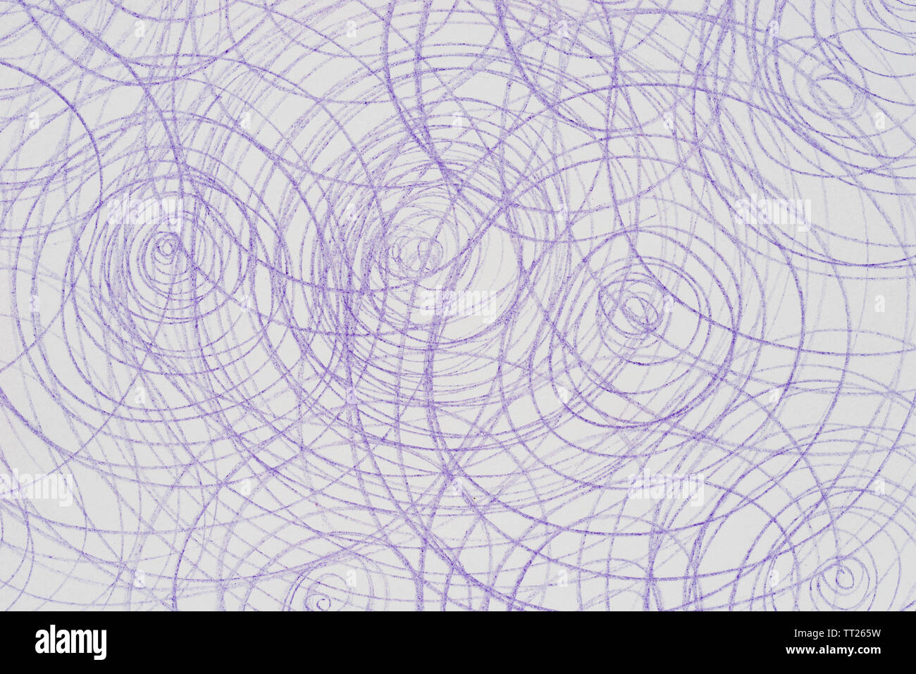 violet crayon doodles on white paper background Stock Photo