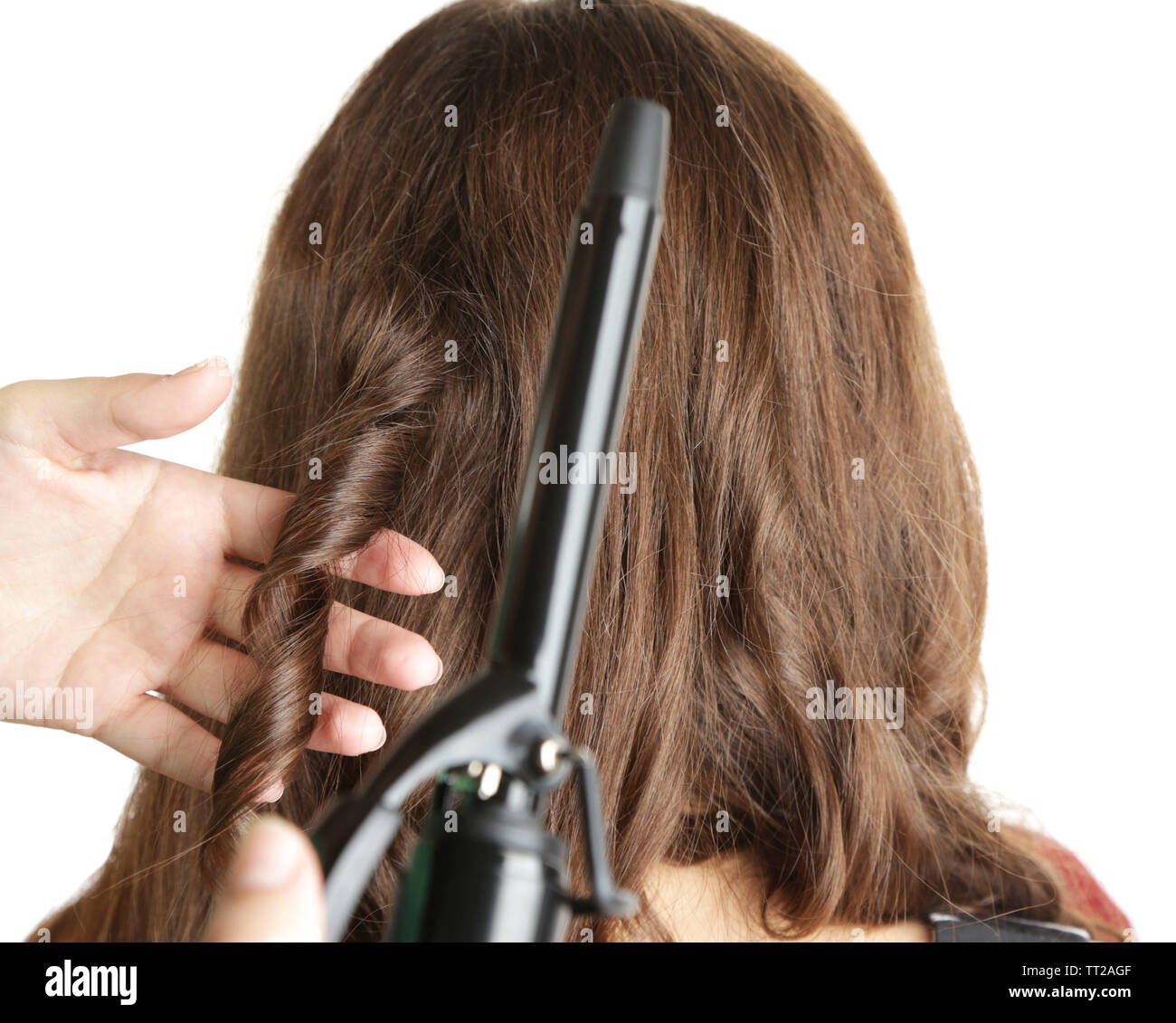 Stylist Using Curling Iron For Hair Curls Close Up Isolated On