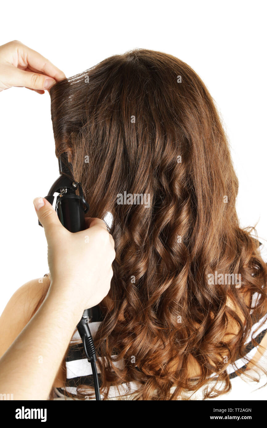 Stylist Using Curling Iron For Hair Curls Close Up Isolated On