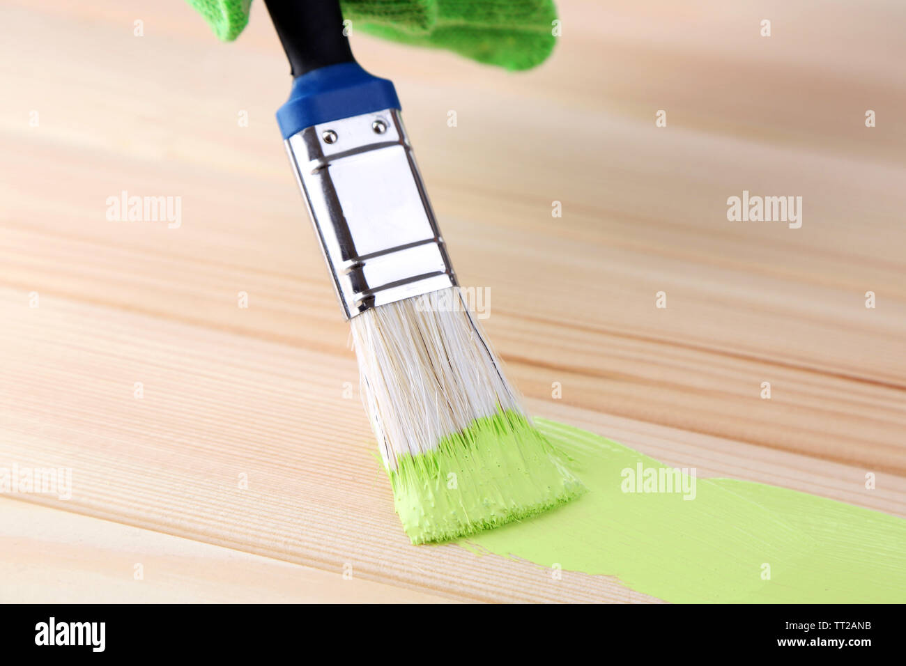 Brush painting wooden furniture, close up Stock Photo Alamy