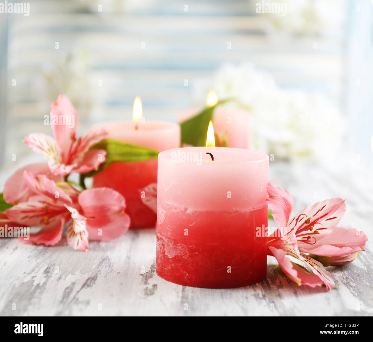 Beautiful Candles With Flowers On Wooden Background Stock Photo Alamy