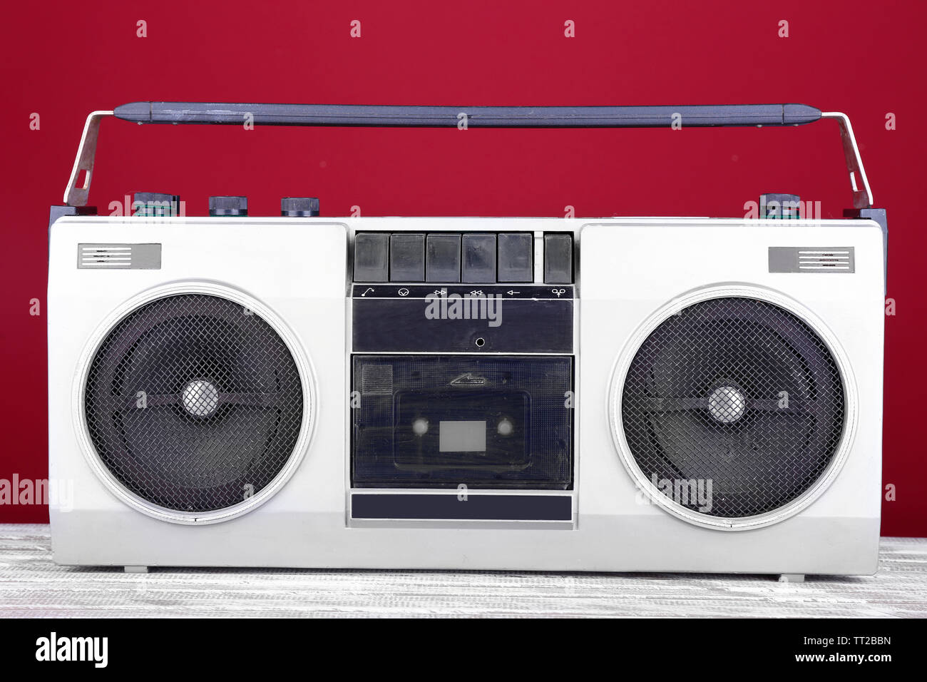 Retro cassette stereo recorder on table on red background Stock Photo