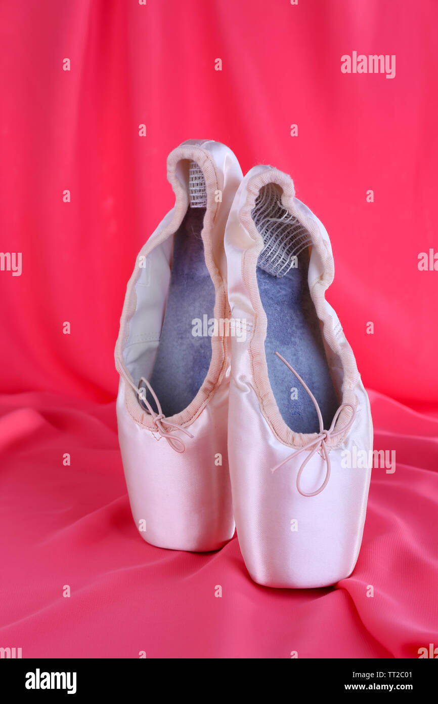 Ballet pointe shoes on red fabric background Stock Photo Alamy