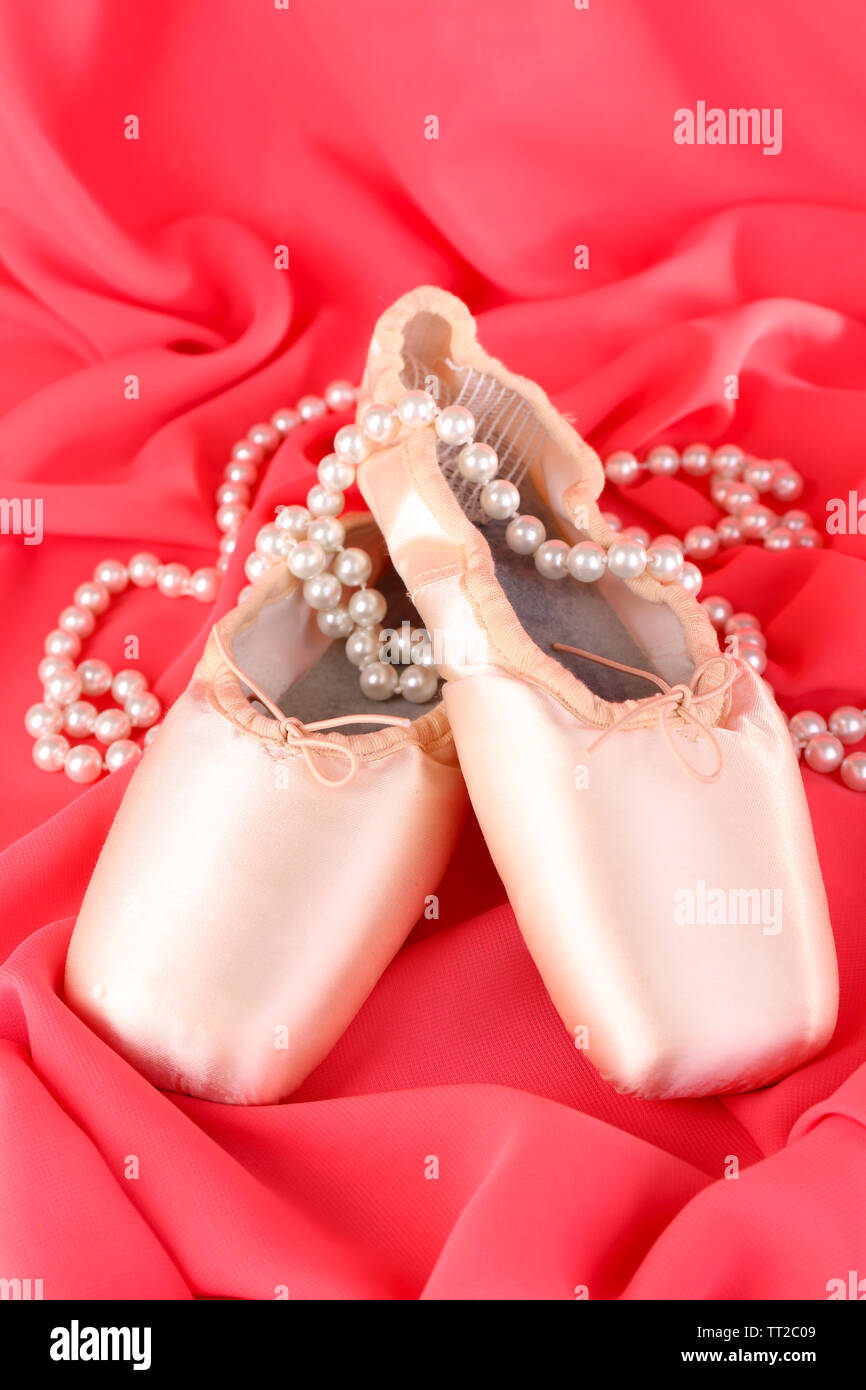 Ballet pointe shoes on red fabric background Stock Photo Alamy
