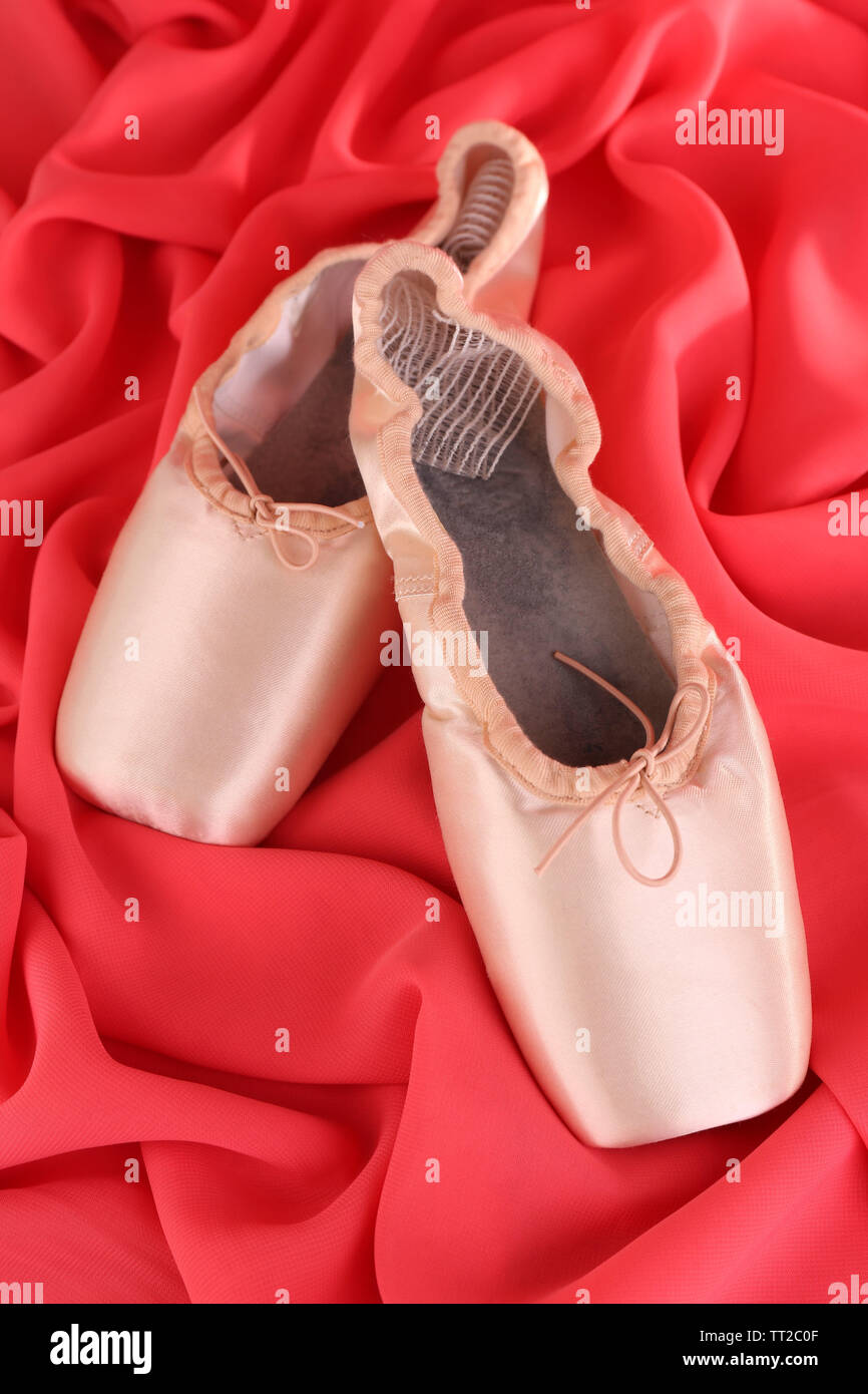 Ballet pointe shoes on red fabric background Stock Photo Alamy