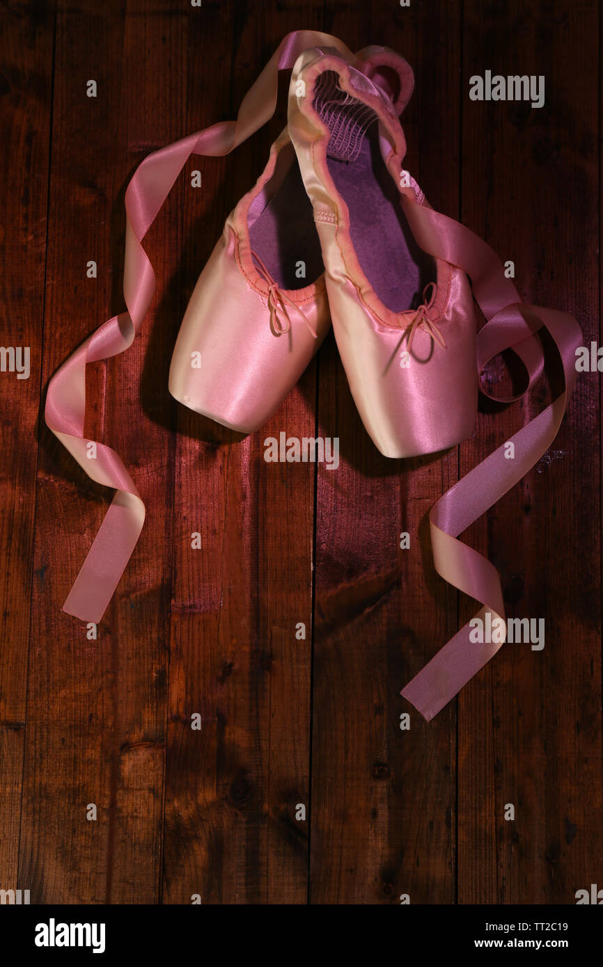 Ballet pointe shoes on wooden background Stock Photo - Alamy