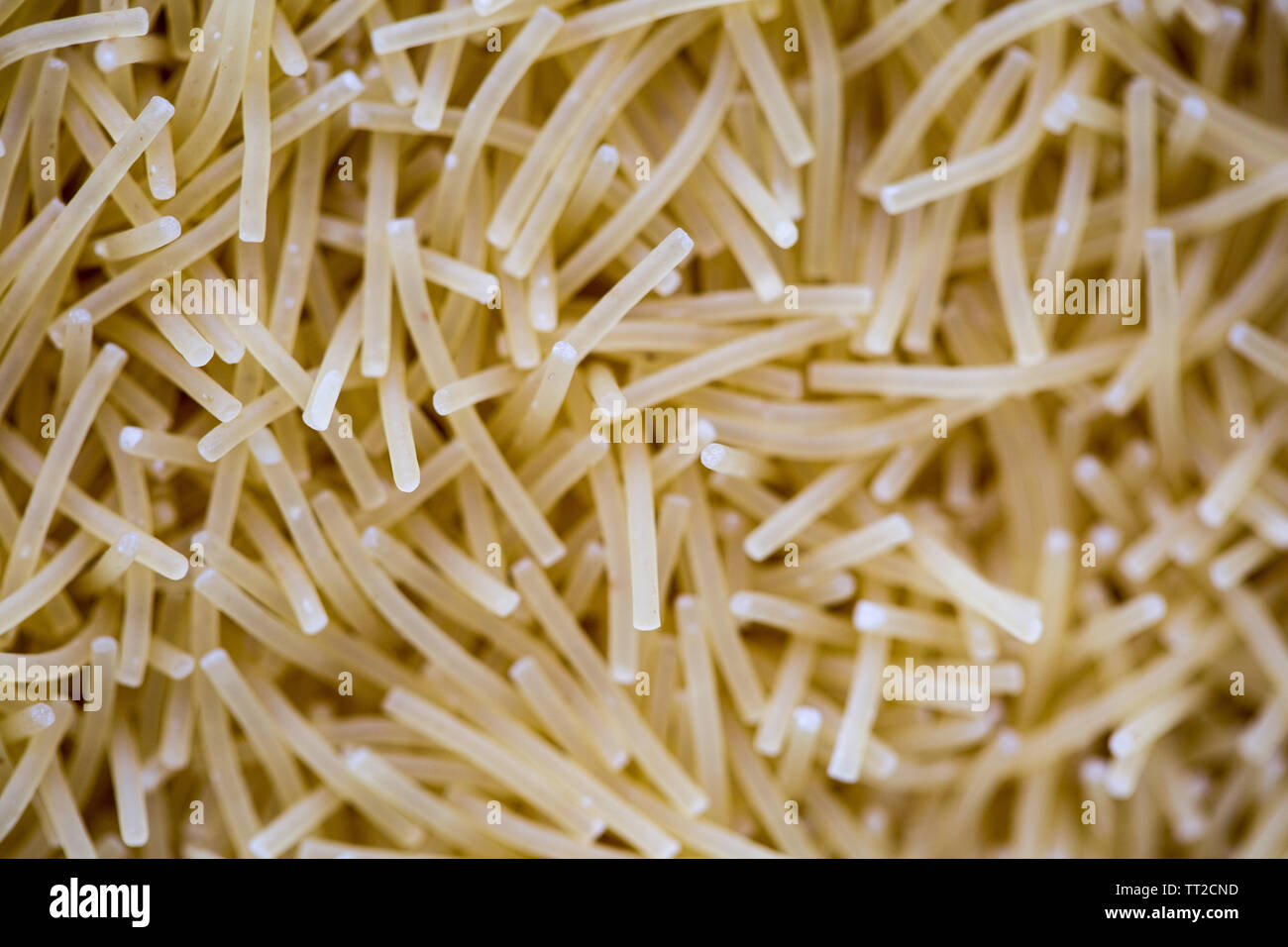 angel hair vermicelli raw uncooked pattern texture macro Stock Photo