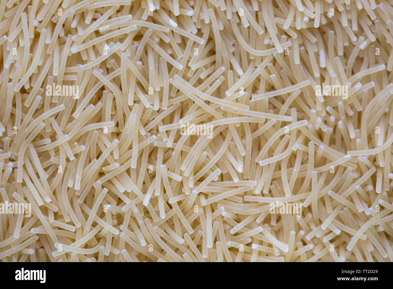 angel hair vermicelli raw uncooked pattern texture macro Stock Photo