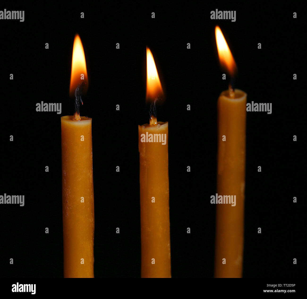 Burning candles on black background Stock Photo - Alamy