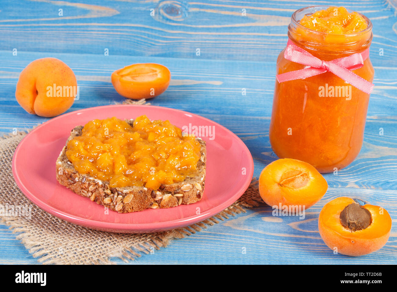 Fresh prepared sandwich with homemade apricot marmalade and ripe fruits, concept of healthy sweet snack Stock Photo
