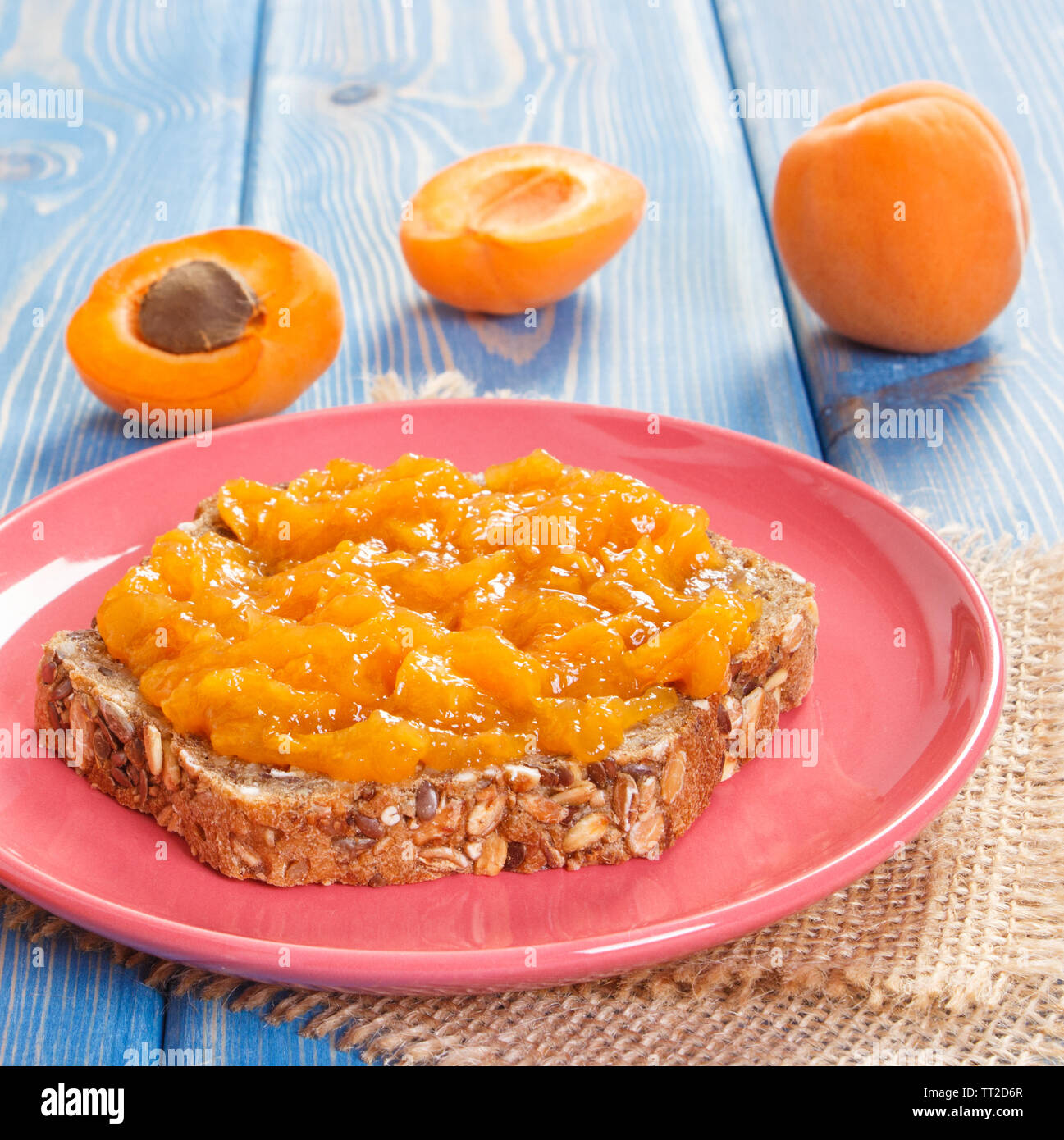 Sandwich with apricot jam or marmalade on plate, concept of healthy sweet dessert Stock Photo