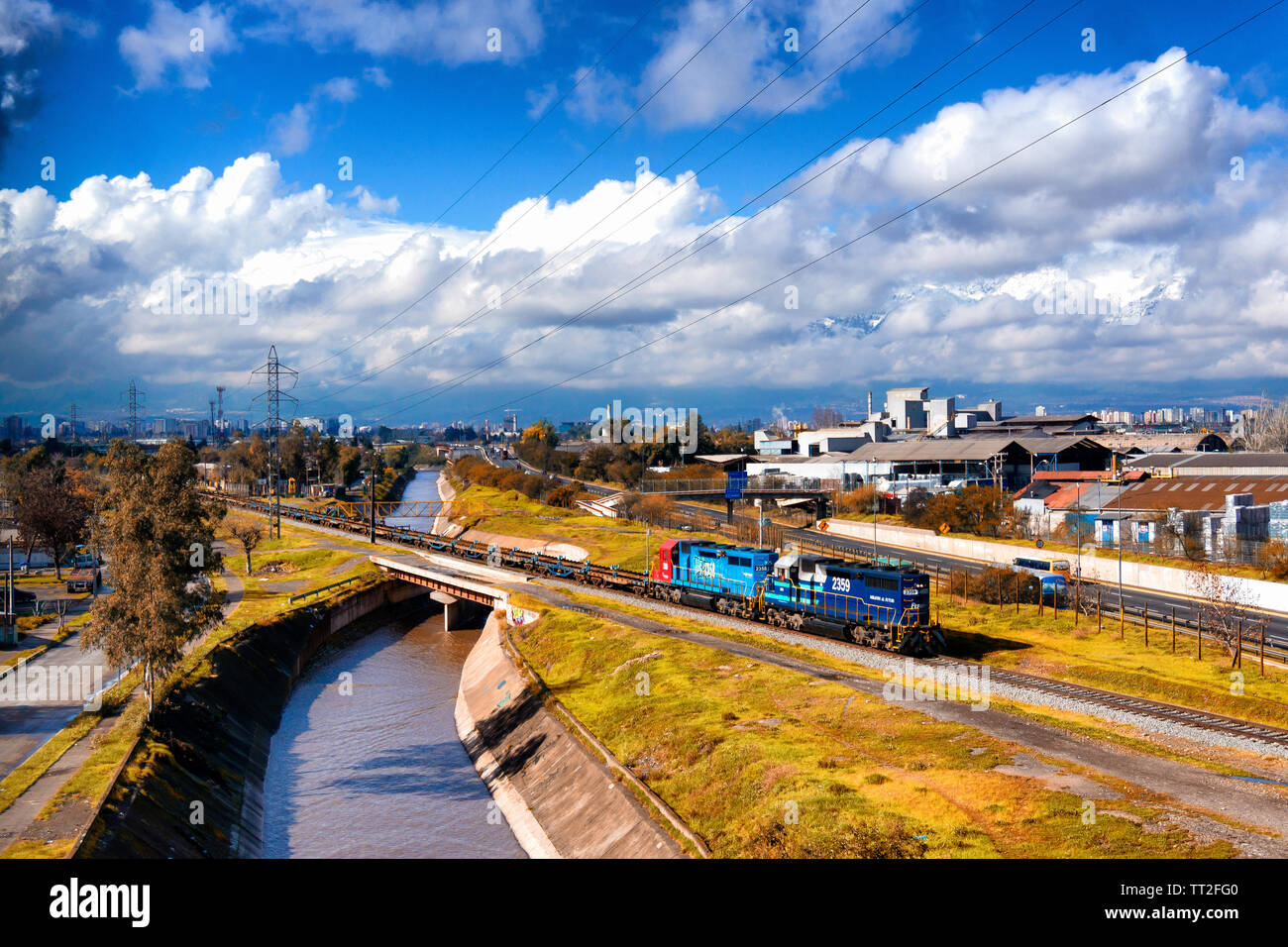 SANTIAGO, CHILE - JULY 2016: A cargo train passes with the clouds as background Stock Photo