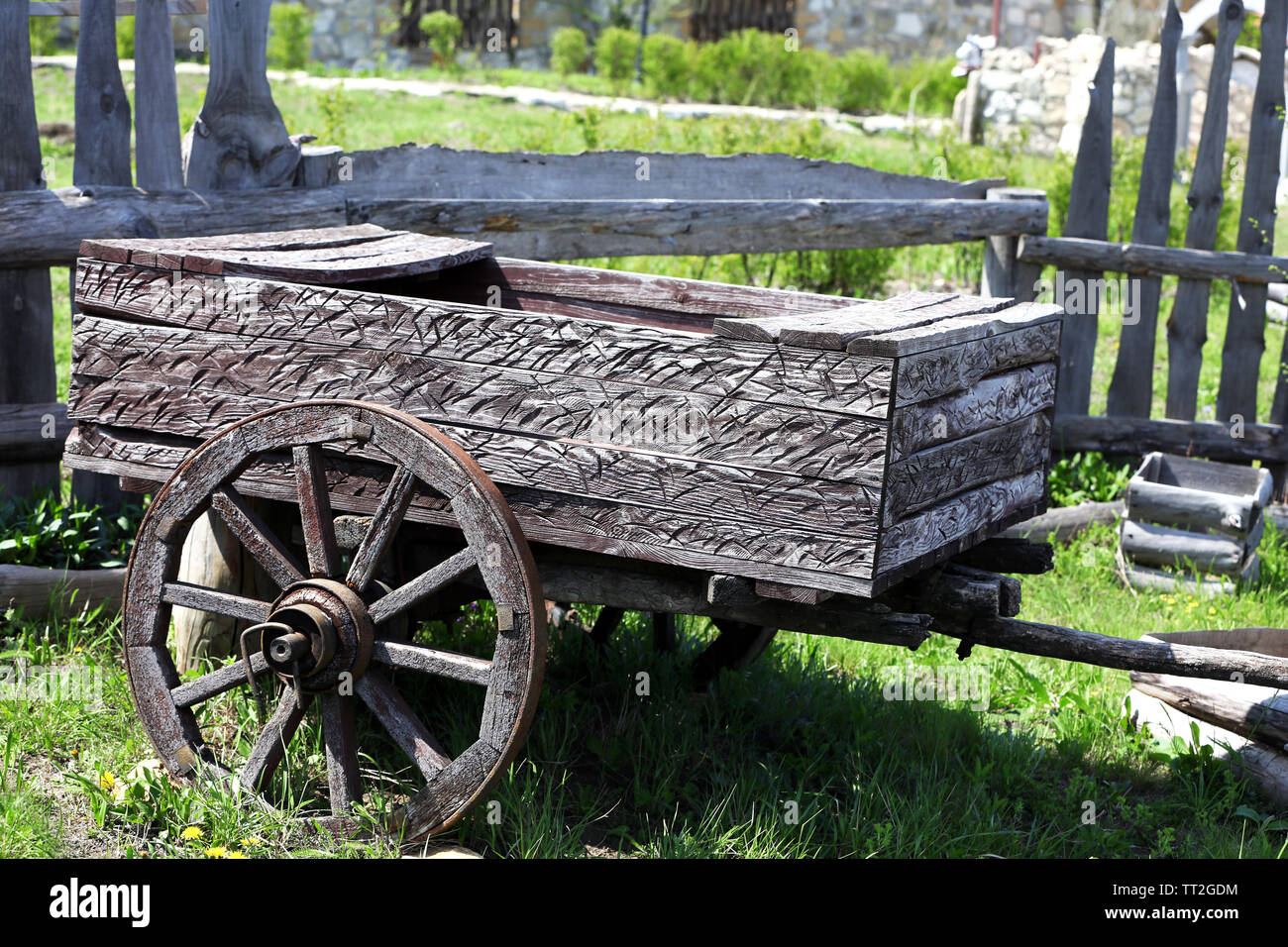 Wooden cart on nature background Stock Photo - Alamy