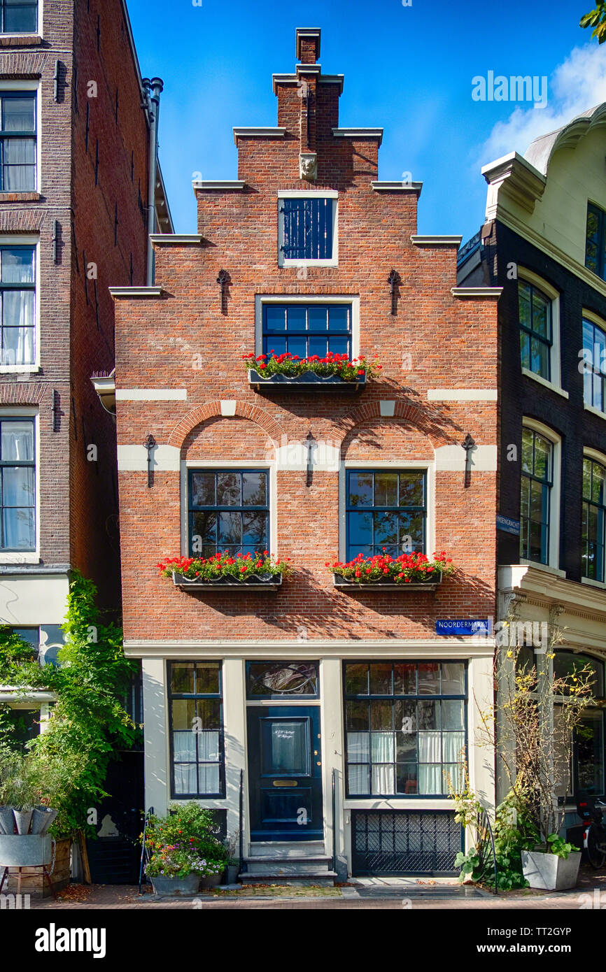 Small Gabled Historic House in a Street Corner, Amsterdam, North Holland, Netherlands Stock Photo