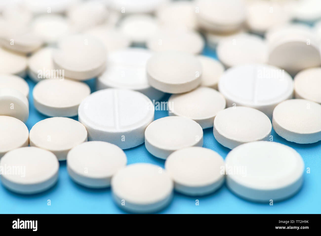 Macro photo of pills. Close-up of round white pills. Stock Photo