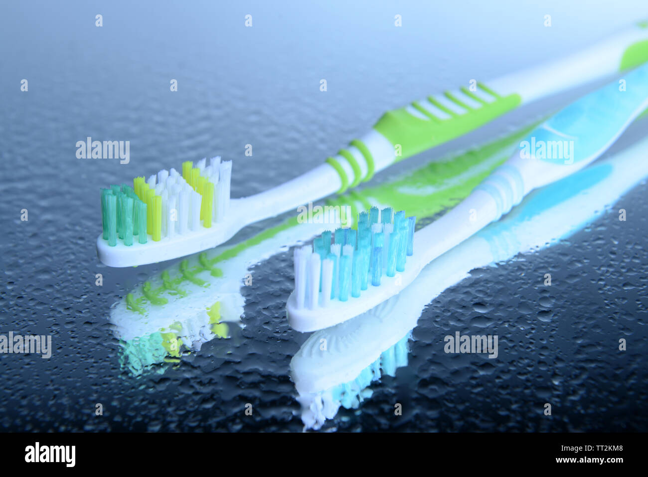 Toothbrushes on blue background Stock Photo - Alamy