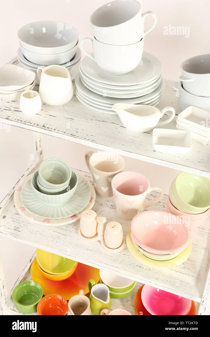Different tableware on shelf, close up Stock Photo - Alamy