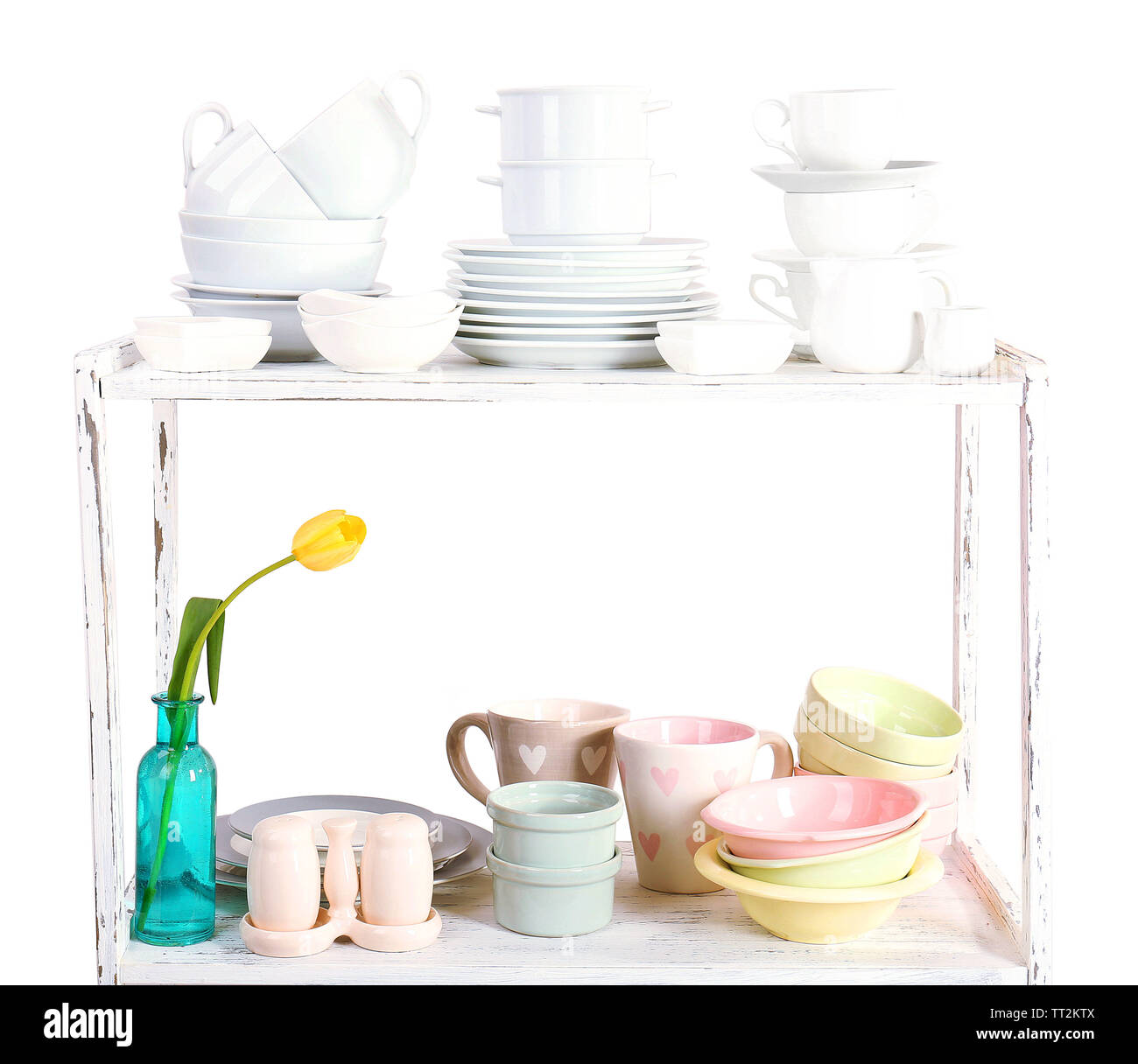 Different tableware on shelf, isolated on white Stock Photo - Alamy