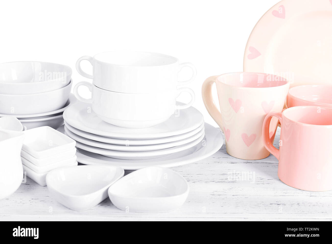 Different tableware on shelf, isolated on white Stock Photo - Alamy
