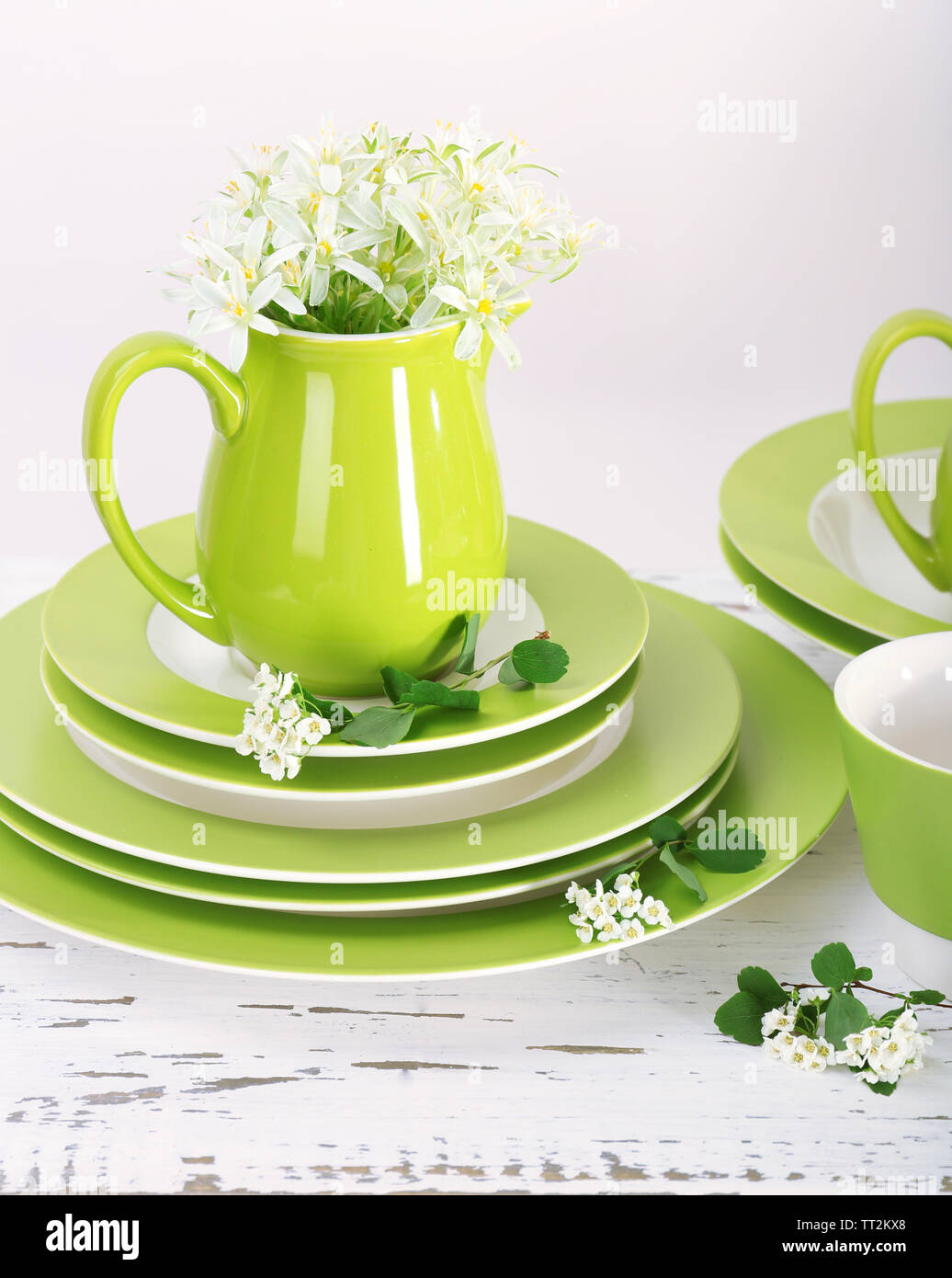 Different tableware on shelf, isolated on white Stock Photo - Alamy