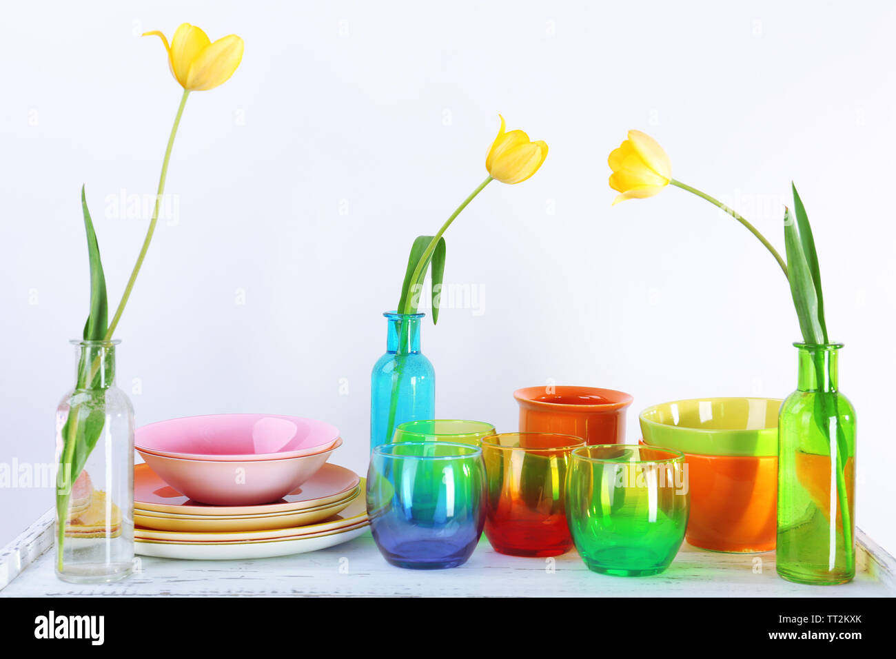Different tableware on shelf, isolated on white Stock Photo - Alamy