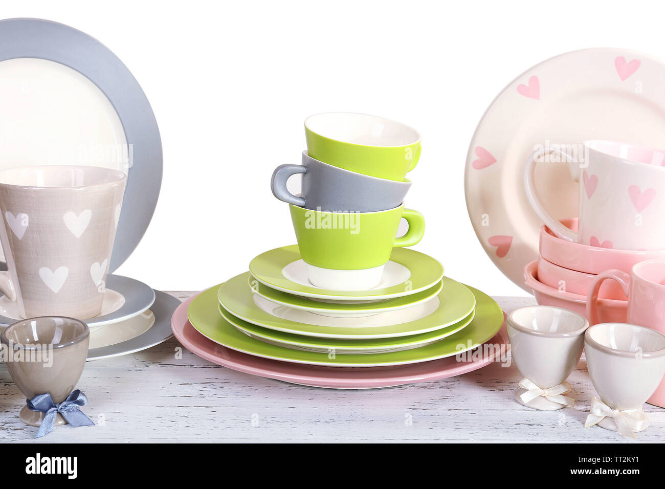 Different tableware on shelf, isolated on white Stock Photo - Alamy