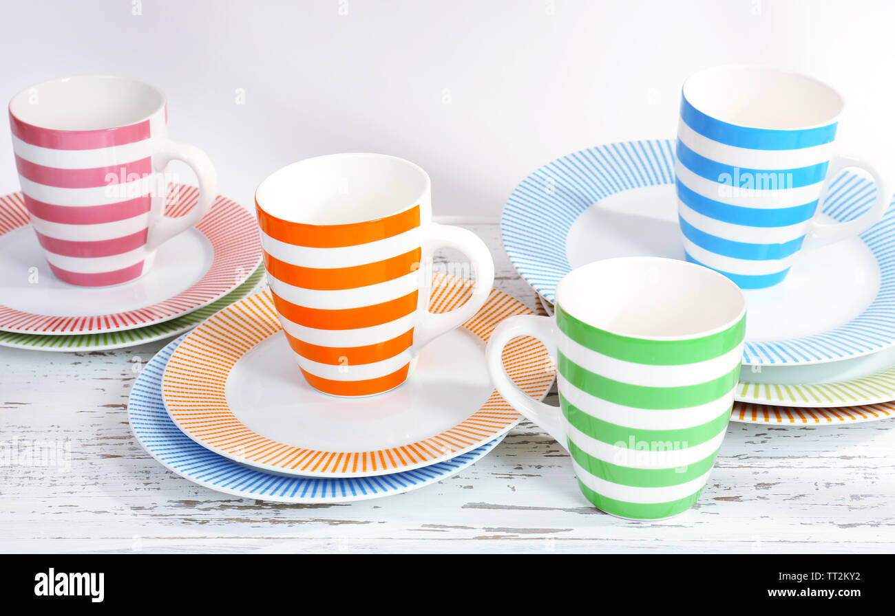 Different tableware on shelf, isolated on white Stock Photo - Alamy