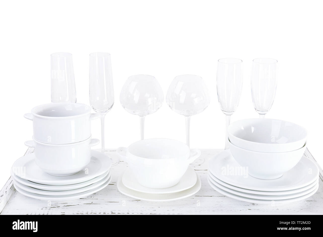 Different tableware on shelf, isolated on white Stock Photo - Alamy