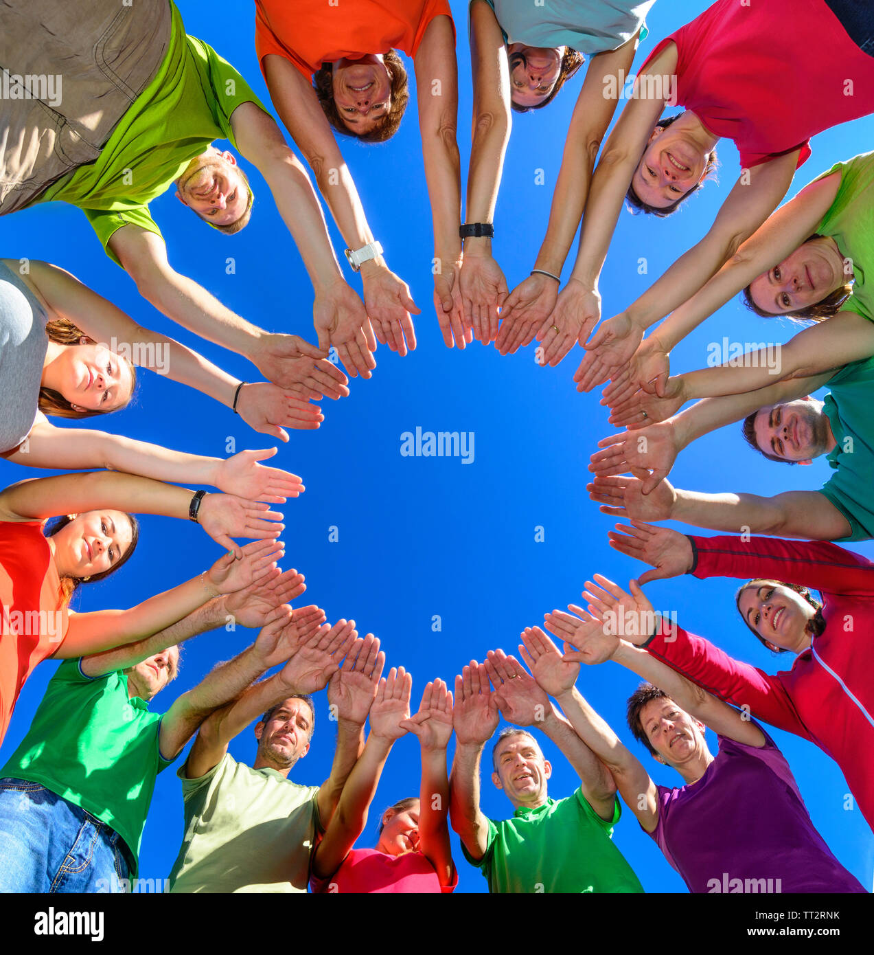 A group of people demontrating their connectedness during a teambuilding exercise in nature Stock Photo