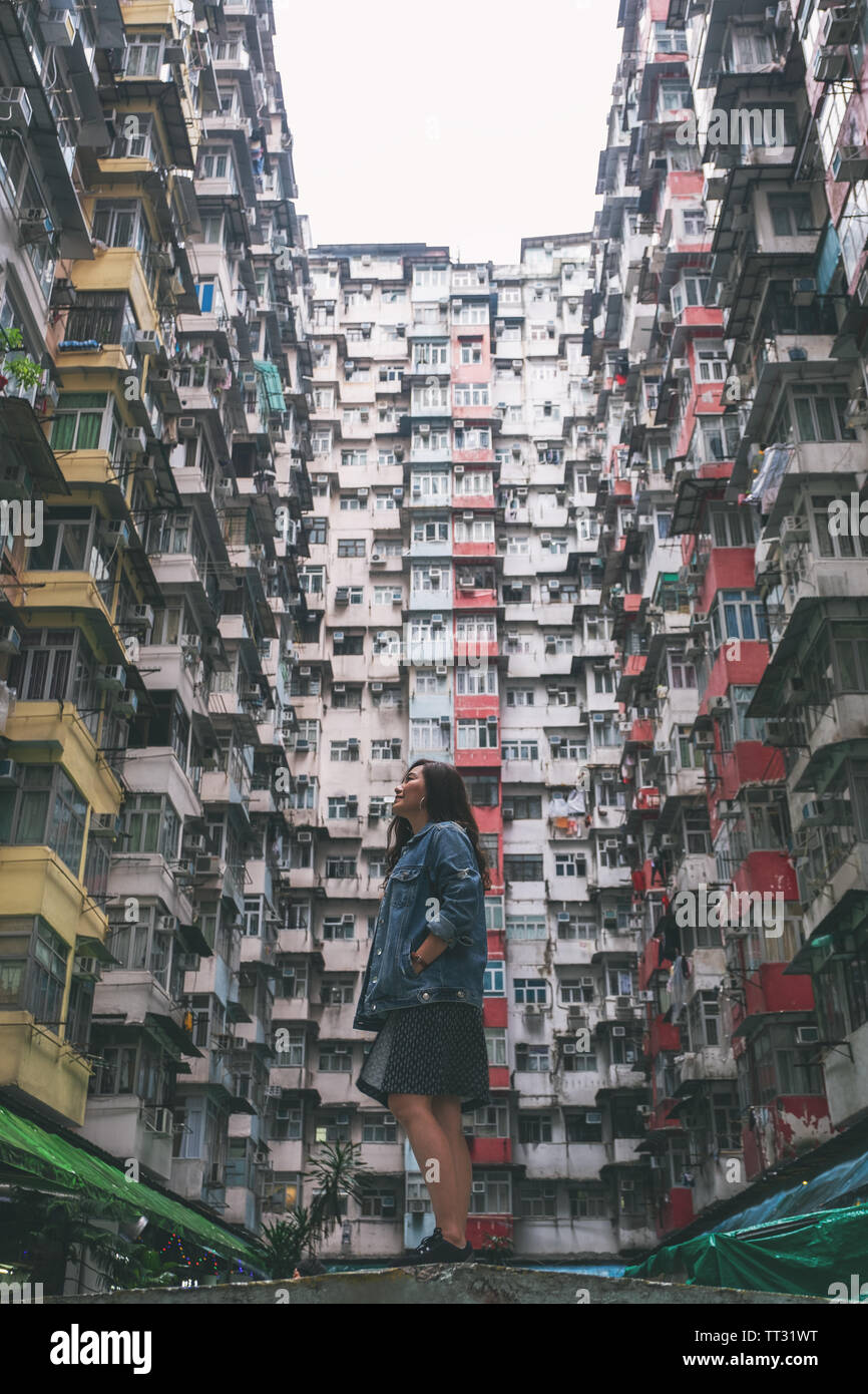 A beautiful asian woman standing among the crowded residential building of  the community in Quarry Bay, Hong Kong Stock Photo - Alamy