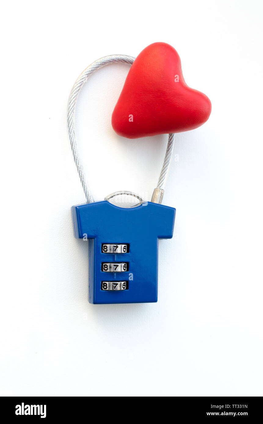 Red heart on a blue combination lock on white background Stock Photo
