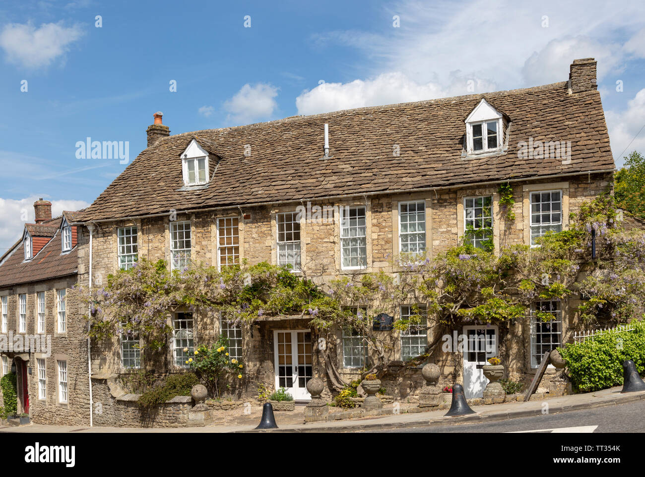 Historic stone buildings in village of Norton St Philip, Somerset