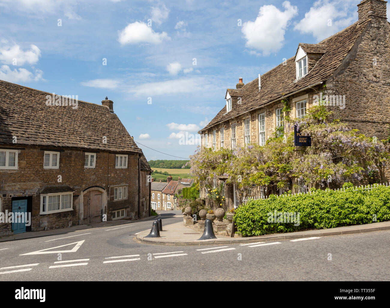 Historic stone buildings in village of Norton St Philip, Somerset