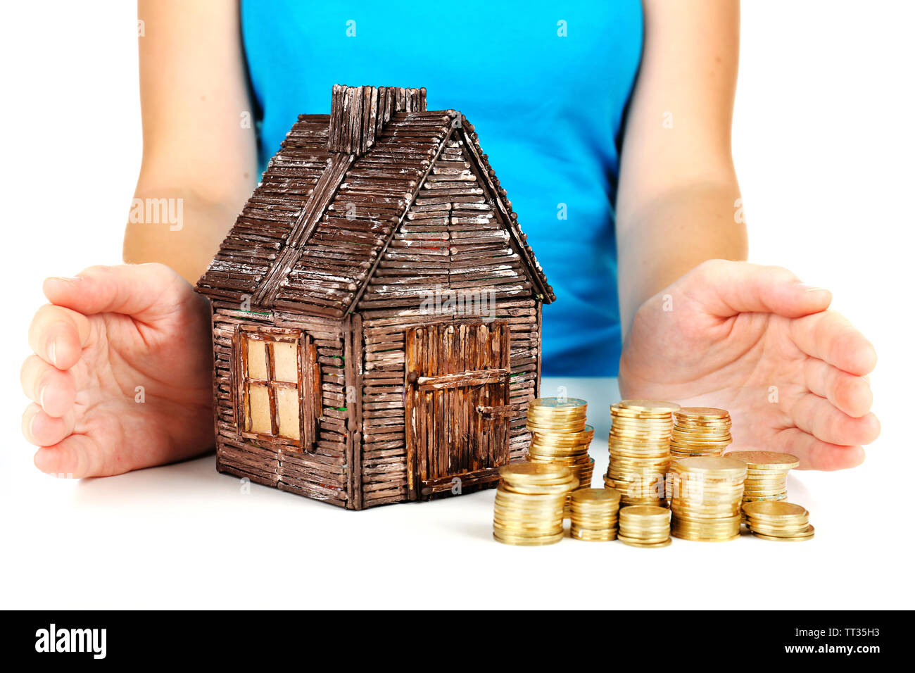 Small wooden house in hands, close up Stock Photo - Alamy