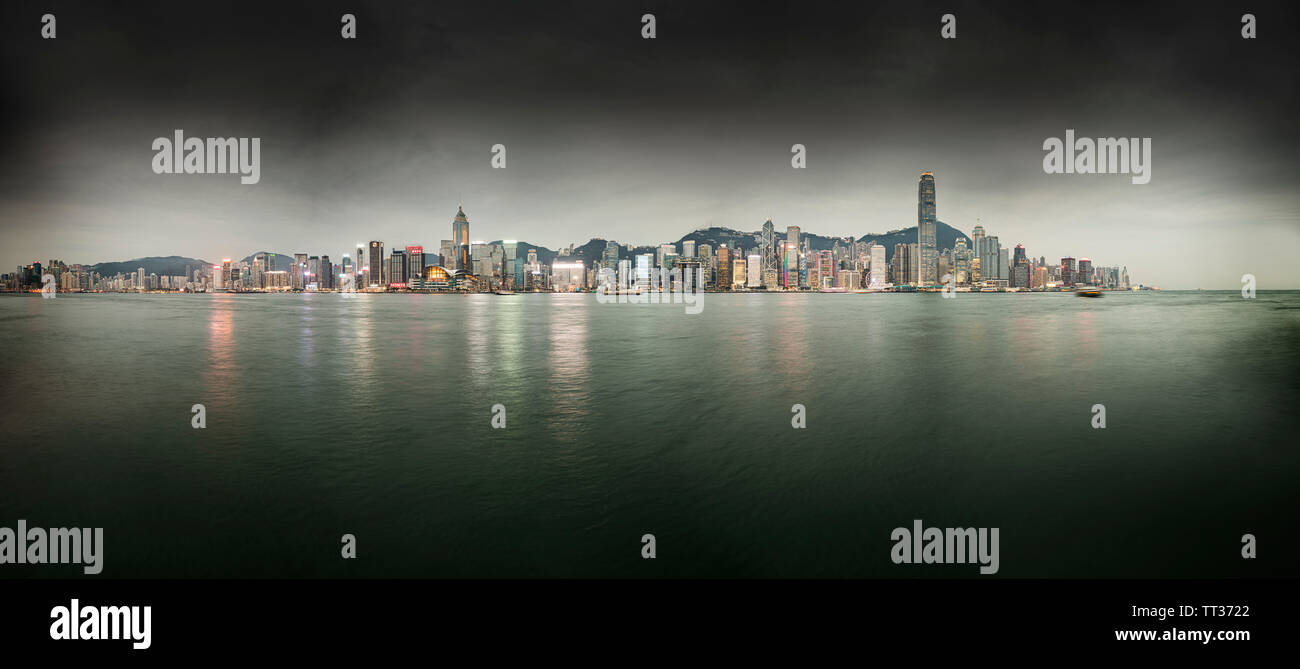 Dark Clouds Over Hong Kong Skyline At Victoria Harbour At Night. China ...