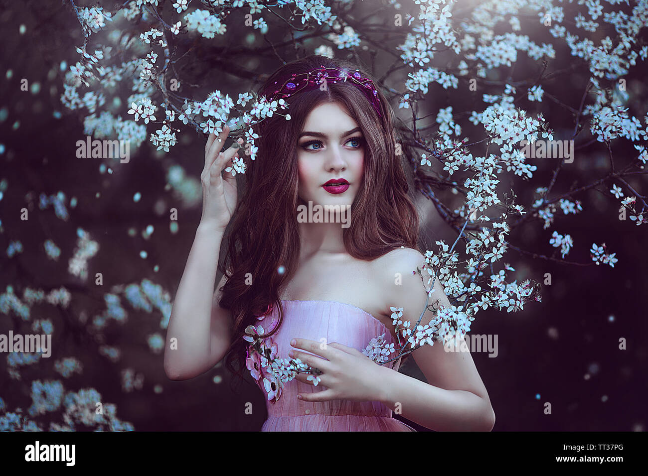 Beautiful Romantic Girl with long hair in pink dress near flowering  tree.Fantasy art. Creative colors and Artistic processing Stock Photo -  Alamy