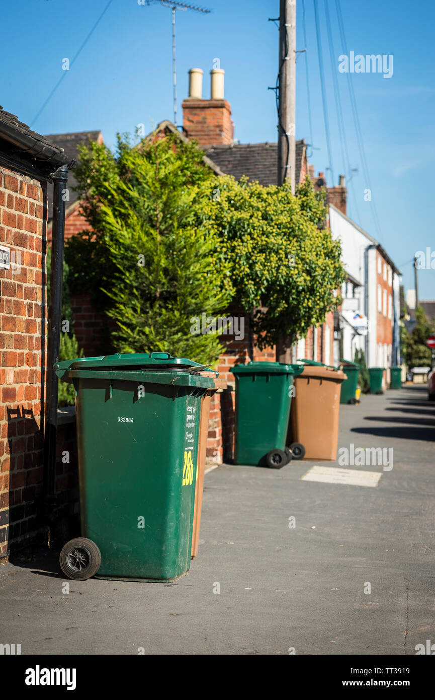 Wheelie bins awaiting collection on a street in the United Kingdom