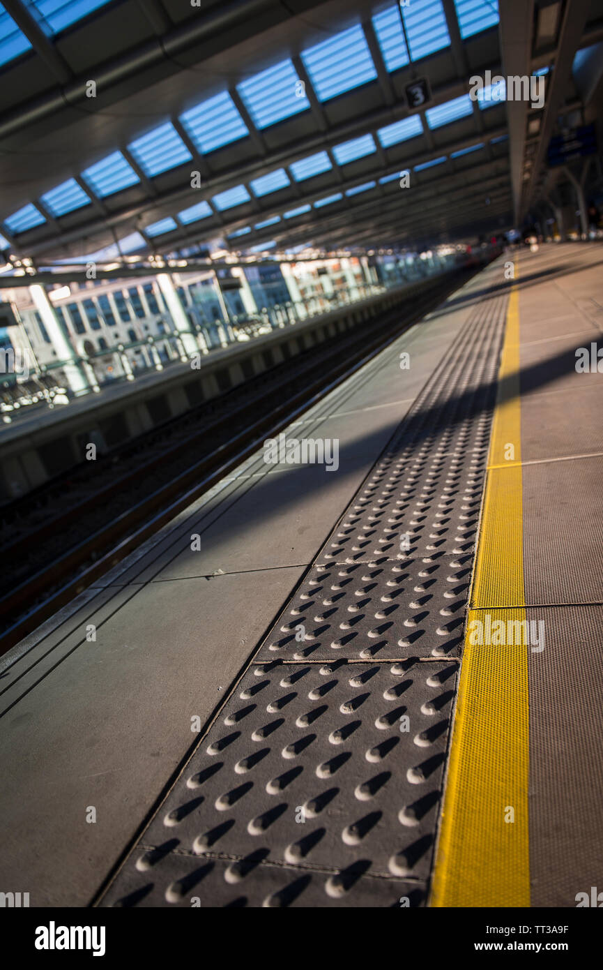 Tactile edging on a platform on the solar bridge at London Blackfriars railway station, London, England. Stock Photo