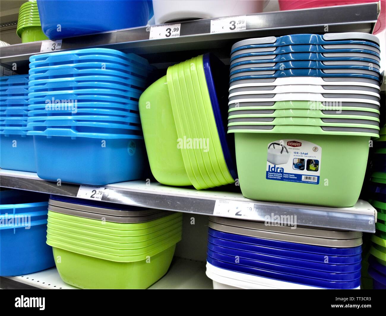 Plates,glasses,and colored plastic cutlery at the Auchan supermarket in