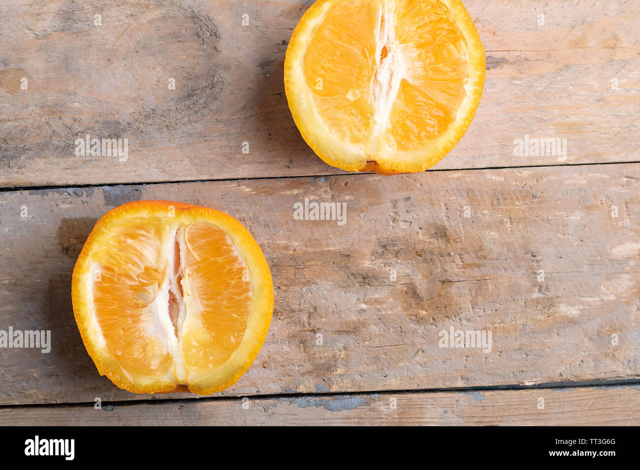 two oranges on wooden table, rustic background,top view Stock Photo