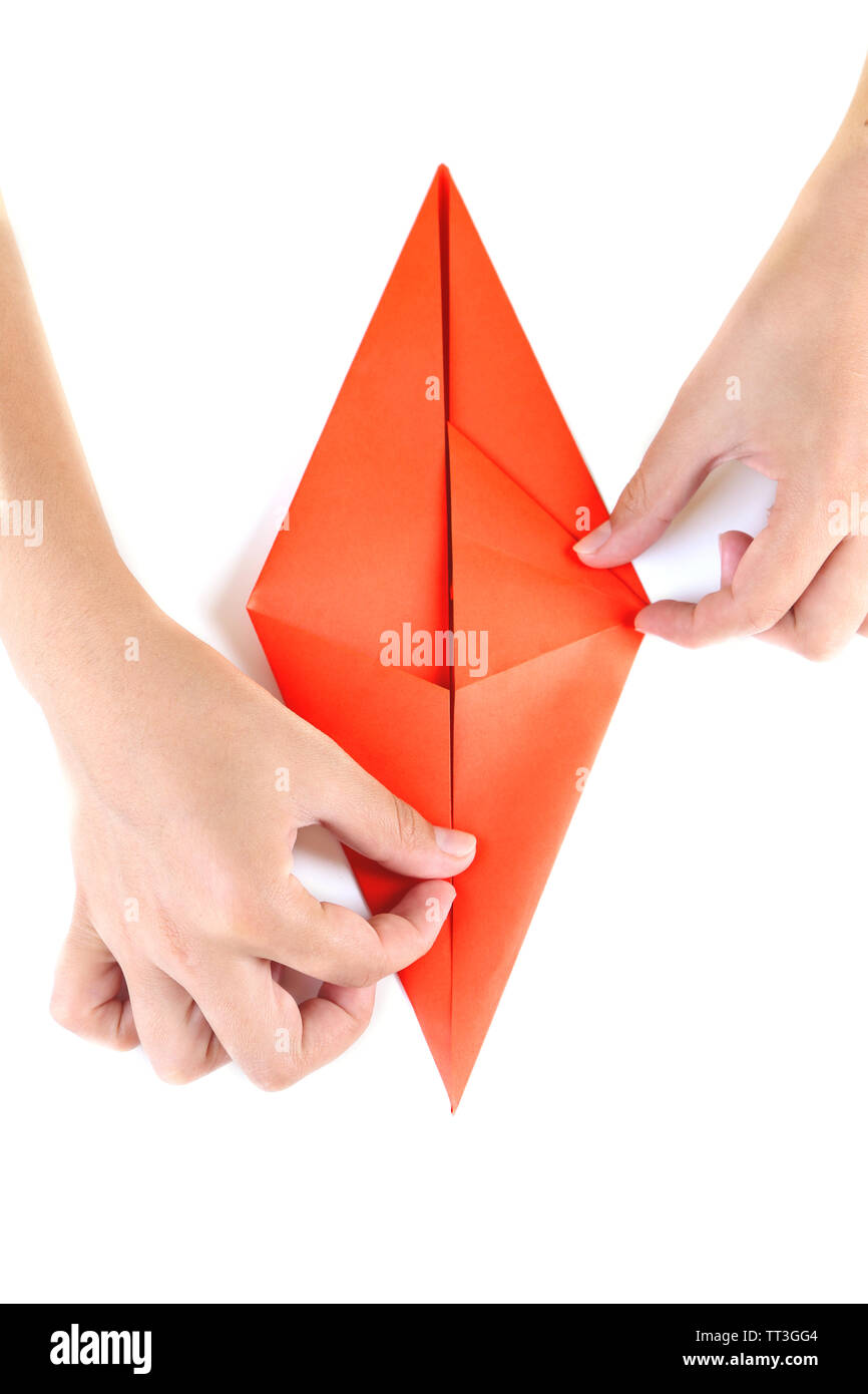 Hands making origami rabbit, close up, isolated on white Stock Photo