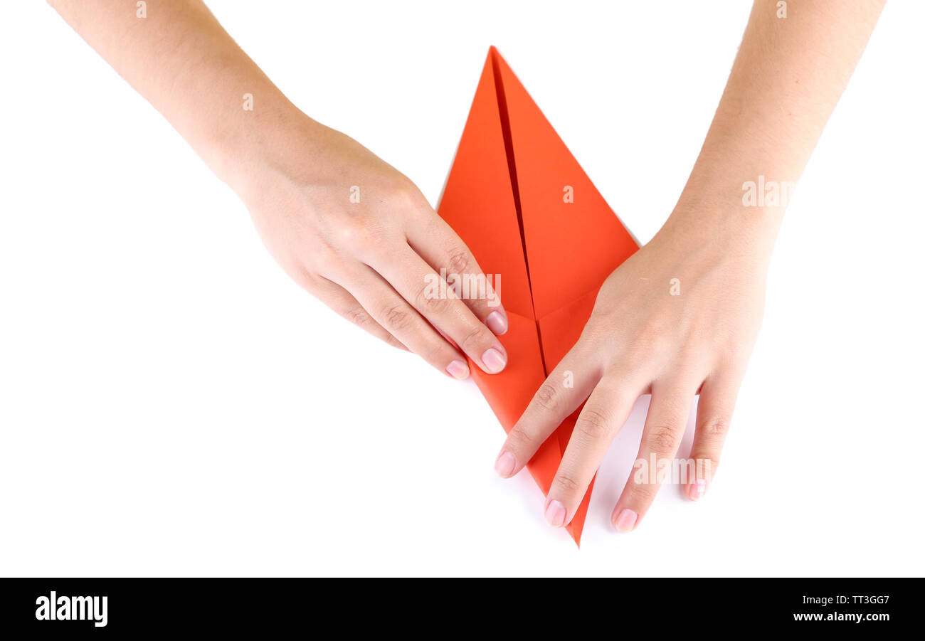 Hands making origami rabbit, close up, isolated on white Stock Photo