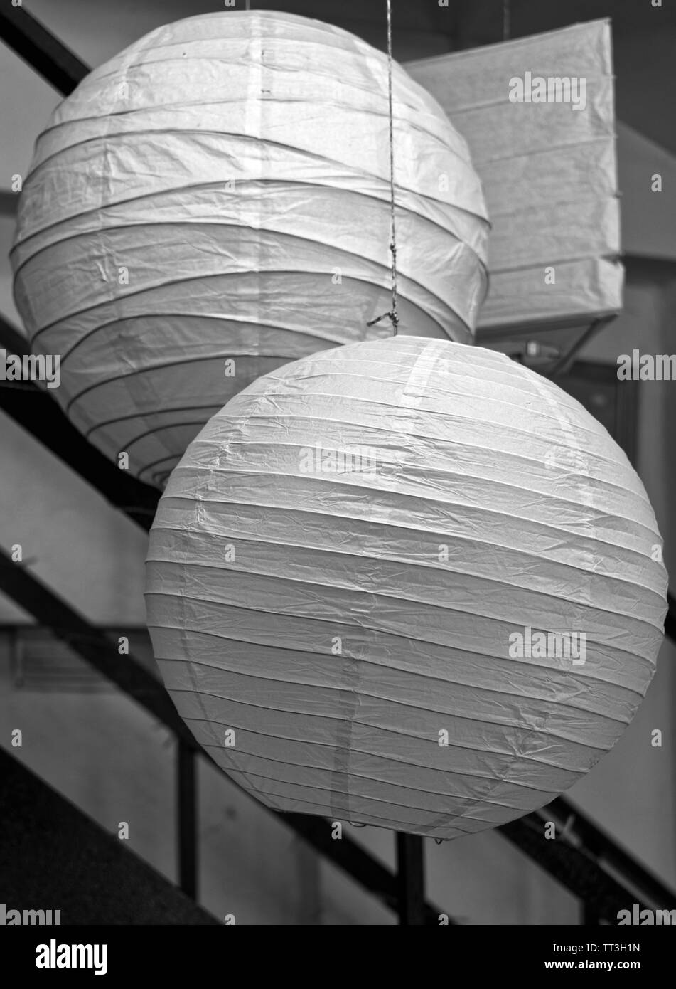 Close-up of two white paper Japanese lampshades Stock Photo
