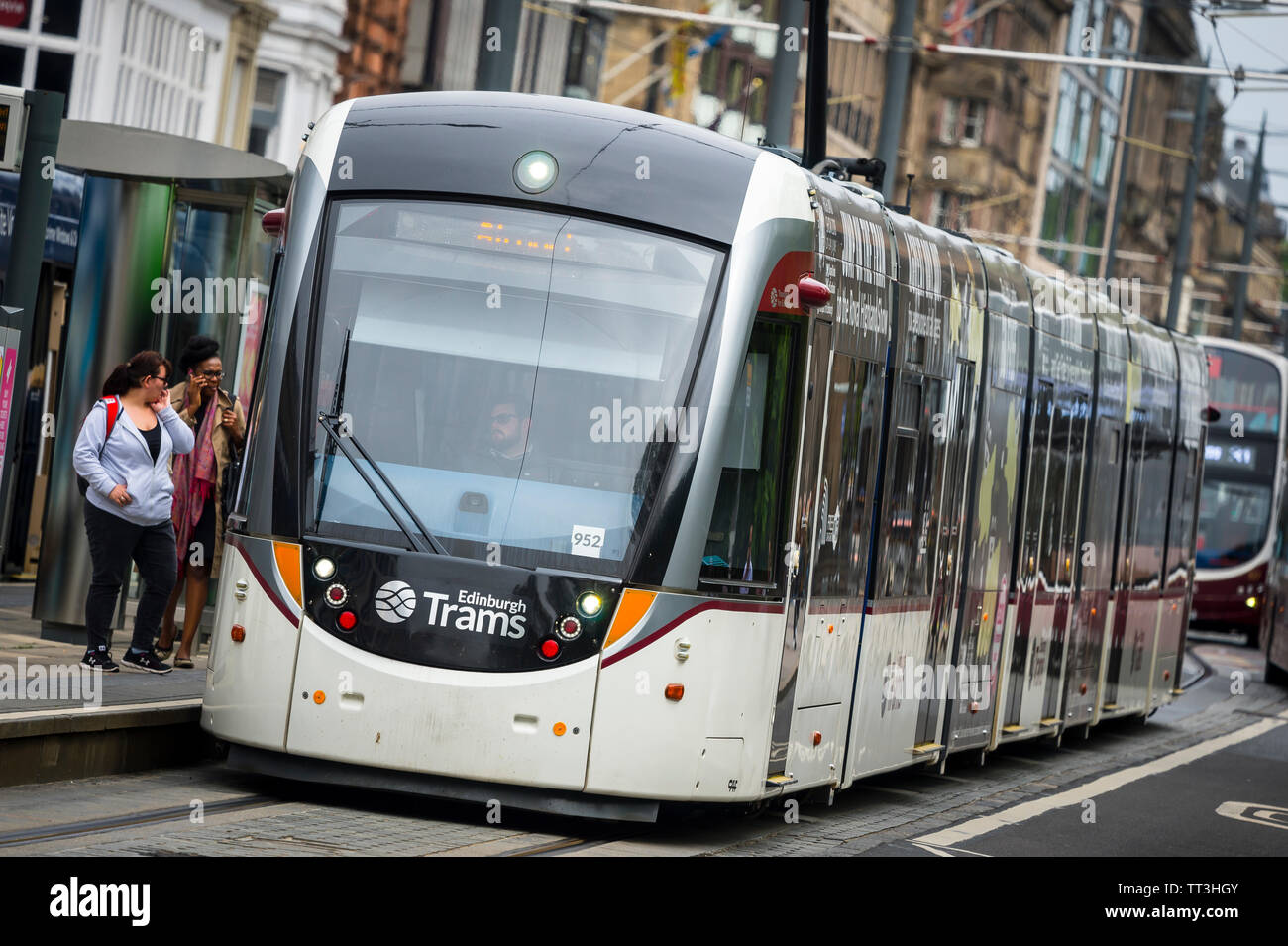Tram waiting at a stop in the centre of the City of Edinburgh, Scotland. Stock Photo