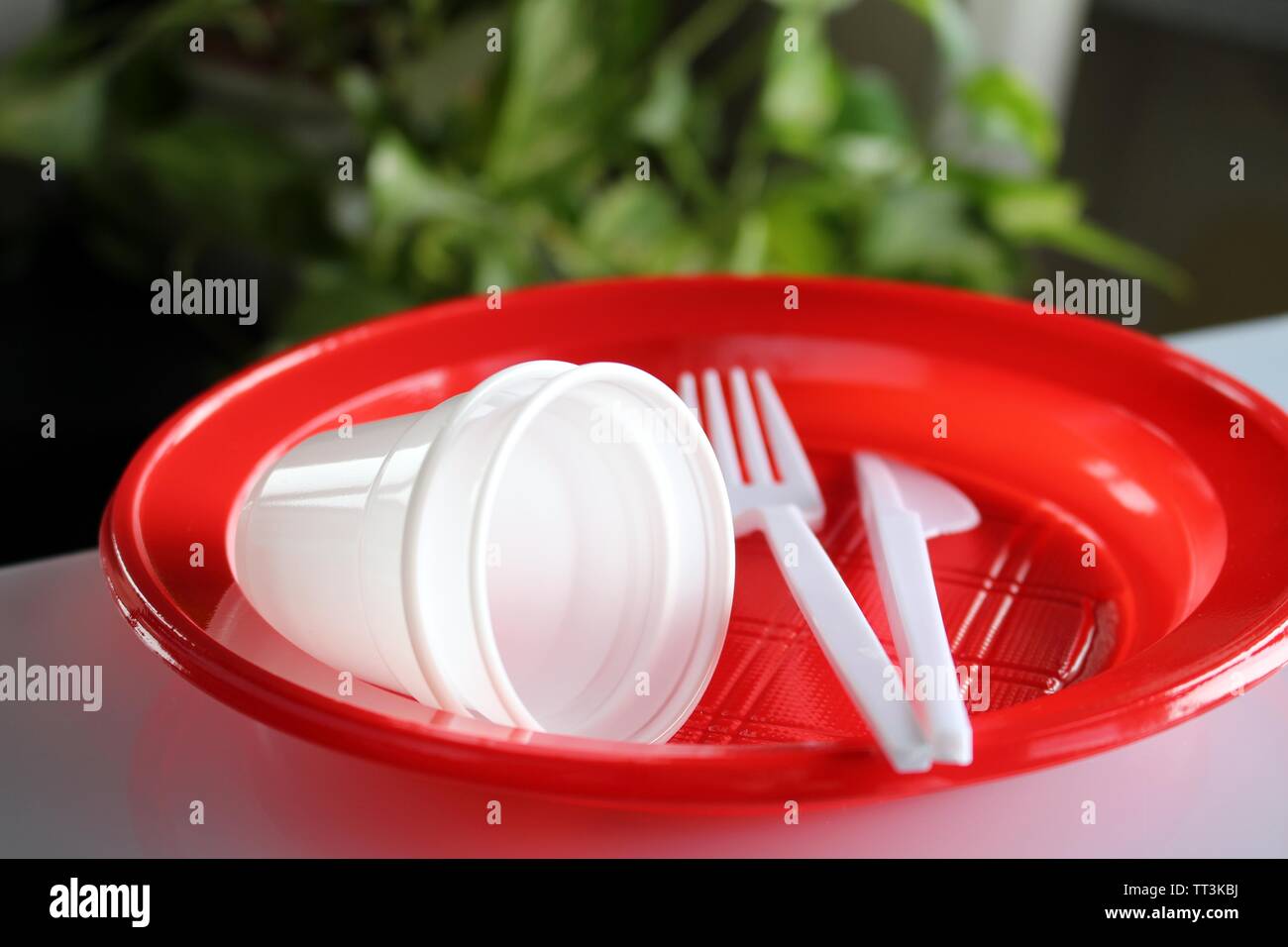 Group of plates with disposable plastic glasses and forks Stock Photo
