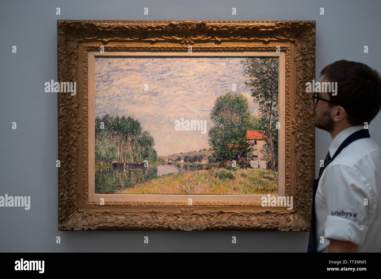 Sotheby’s, London, UK. 14th June 2019. Major Impressionism to Modern British works, some unseen for decades, are previewed for the Sotheby’s summer sale. Image: Alfred Sisley. Les Bords du Loing a Moret, estimate £1m-1.5m. Credit: Malcolm Park/Alamy Live News. Stock Photo