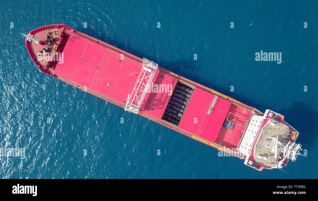 Red General cargo ship at sea - Aerial image Stock Photo