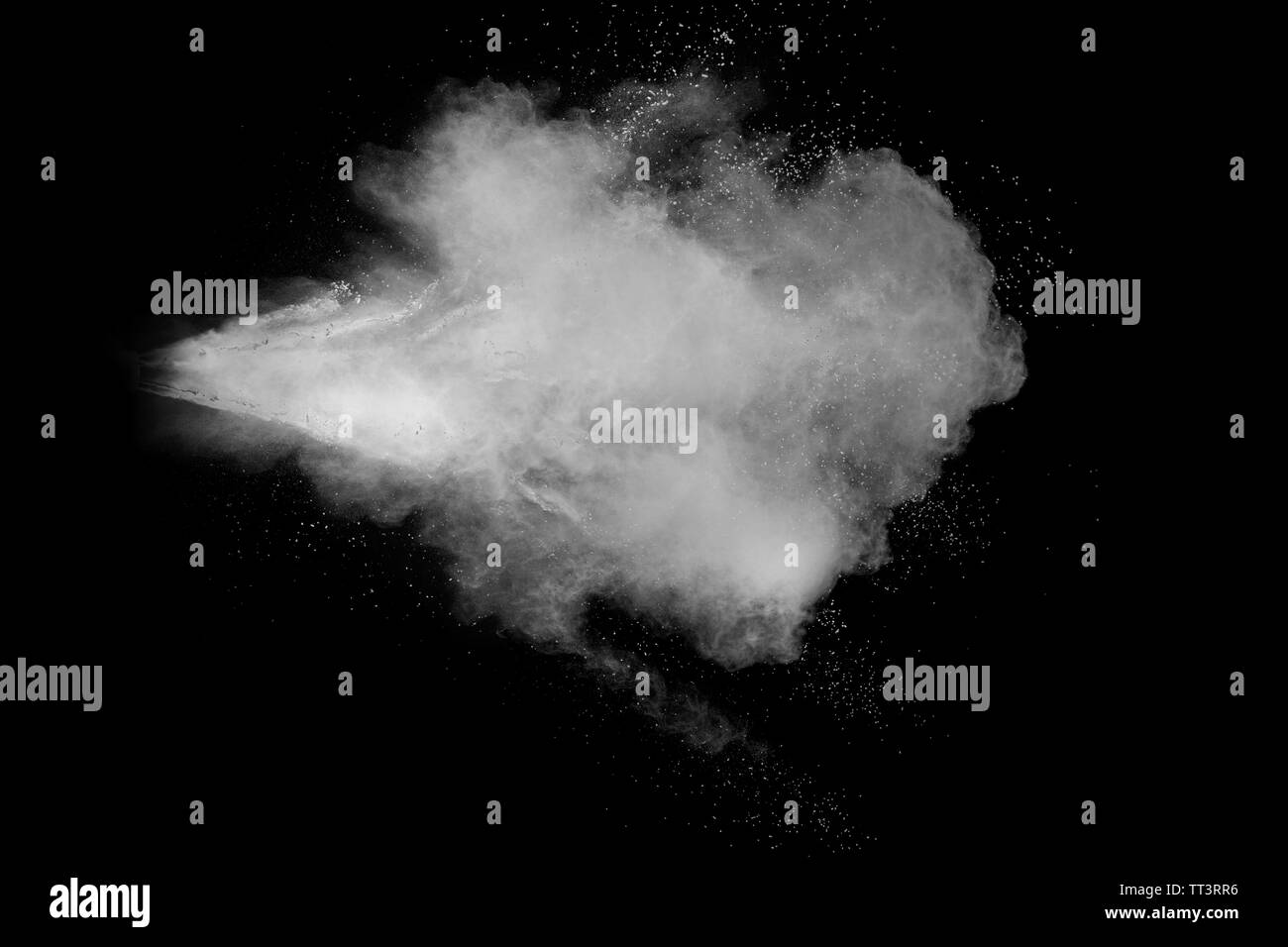 White powder explosion isolated on black background. White dust ...