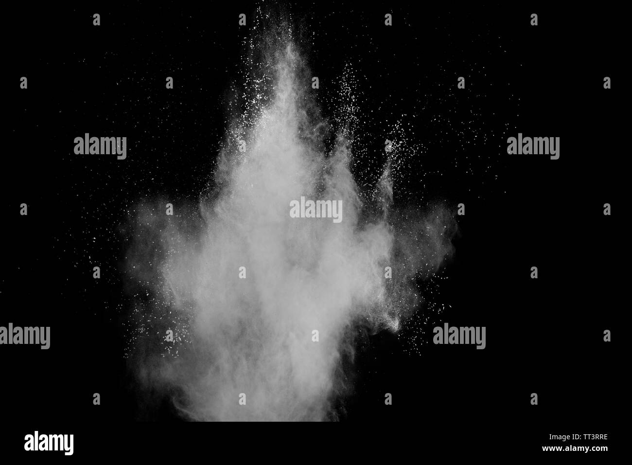 White powder explosion isolated on black background. White dust ...